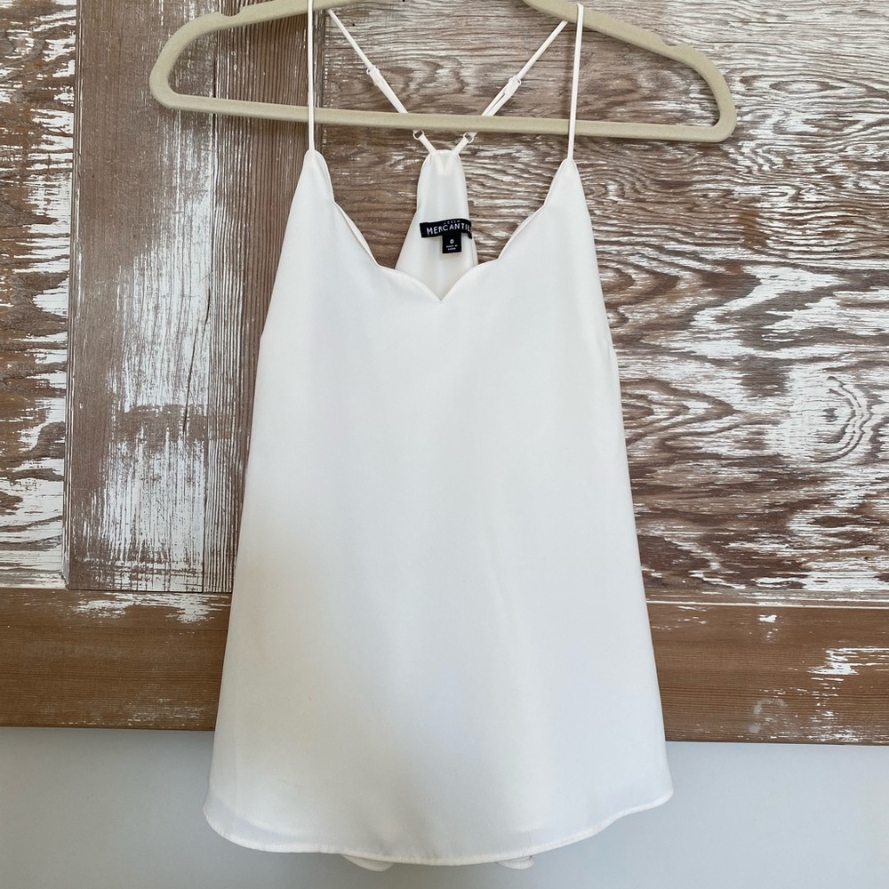 J Crew white tank top with design around the top